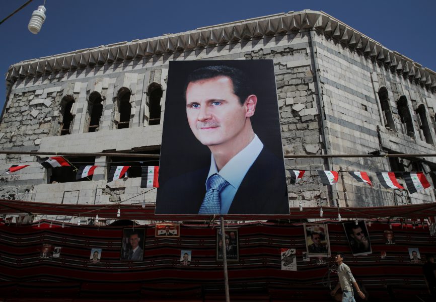 A banner depicting Syrian President Bashar al-Assad in Douma, outside Damascus. REUTERS.