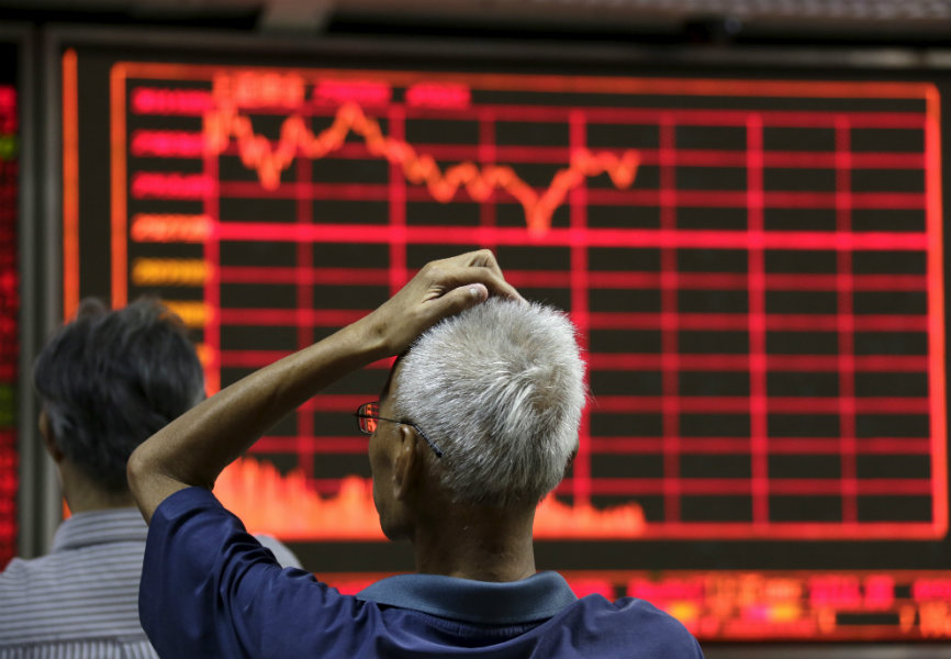 An investor at a brokerage house in Beijing. REUTERS.