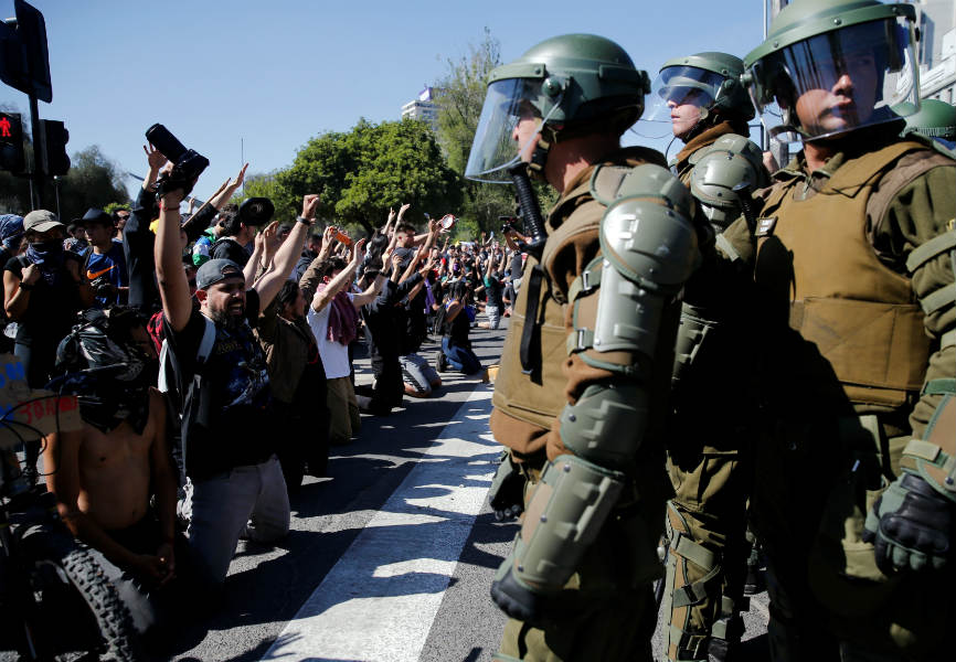Chilean protesters face off against police in Santiago. REUTERS.