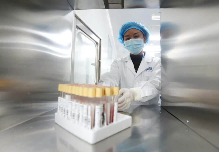 A technician works at China's BGI genetic testing laboratory. REUTERS.