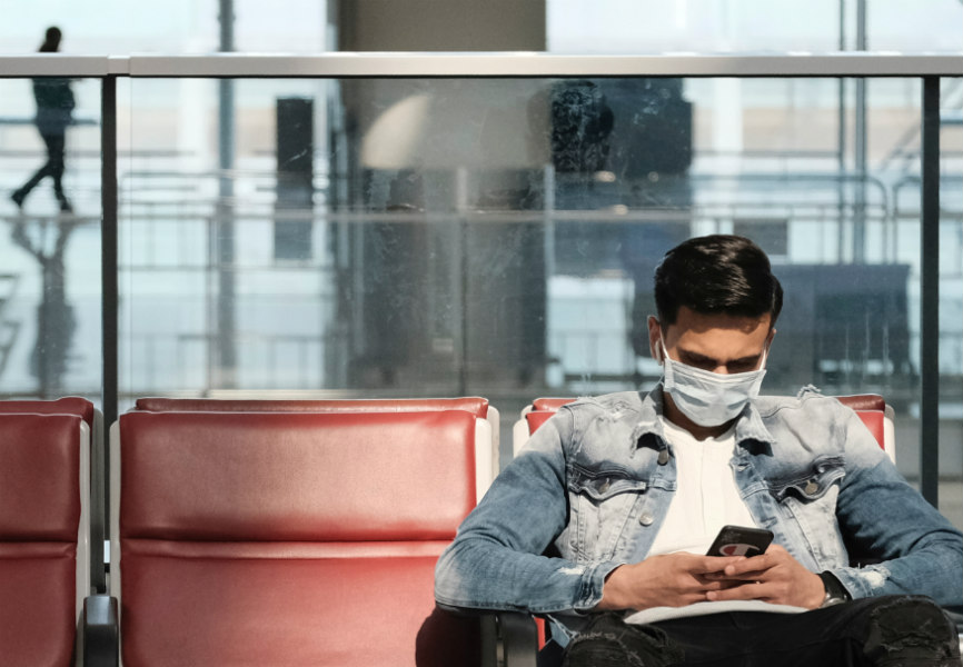 A passenger wears a protective face mask at Hong Kong's airport following the coronavirus outbreak. REUTERS.