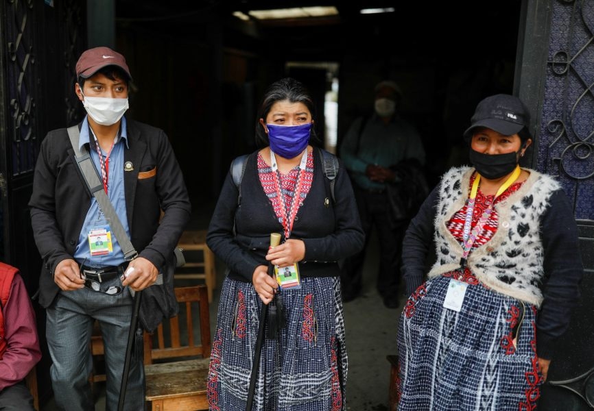 Community members wear face masks at a checkpoint in Guatemala amidst the coronavirus outbreak. REUTERS.