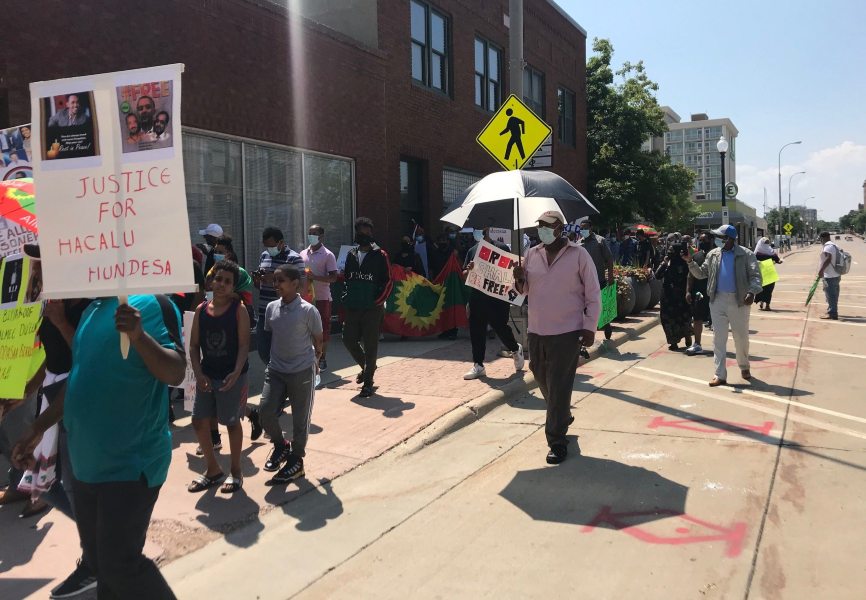 Demonstrators protest against the murder of Ethiopian activist, singer, and political icon Hachalu Hundessa in Sioux Falls, SD. REUTERS.