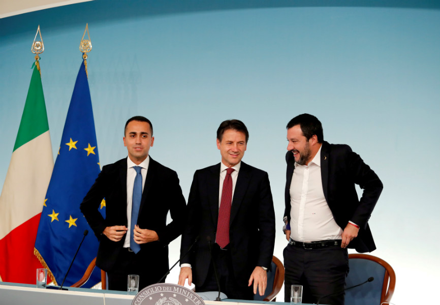 Italy's Minister of Labor and Industry Luigi Di Maio, Prime Minister Giuseppe Conte and Interior Minister Matteo Salvini leave at the end of a news conference after a cabinet meeting at Chigi Palace in Rome. REUTERS.