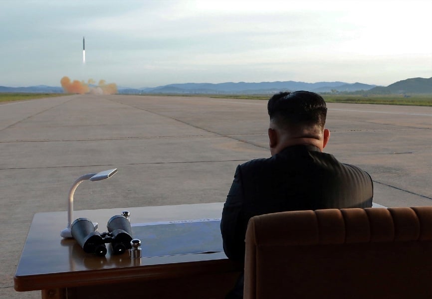 North Korean leader Kim Jong-un watches a missile launch. REUTERS.