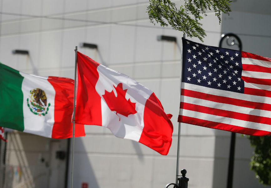 The Mexican, Canadian, and US flags. REUTERS.