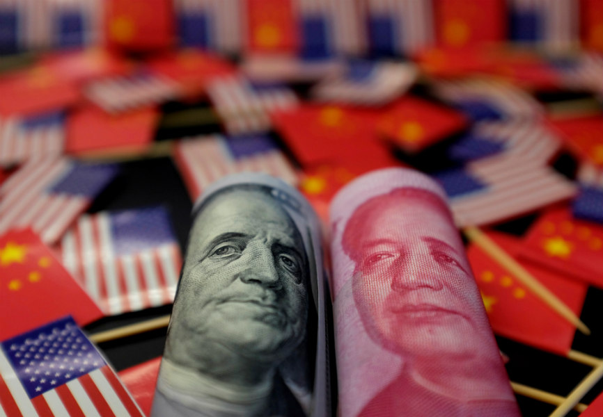 US dollar and Chinese yuan banknotes. REUTERS.